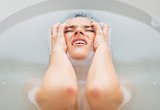 Portrait of frustrated young woman in bathtub