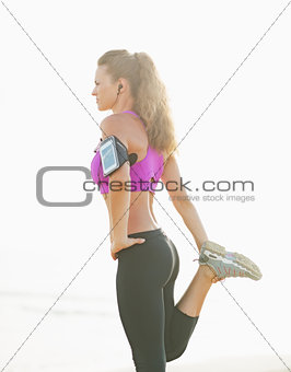 Healthy young woman making exercise outdoors