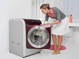 young woman doing laundry