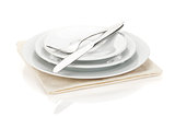 Silverware or flatware set of fork, spoons and knife on plates