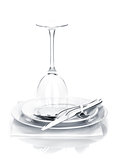 Silverware or flatware set and wine glass over plates