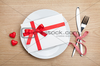 Valentine's Day love letter over plate with silverware