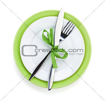 Fork with knife over plates