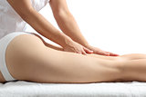 Side view of a woman legs receiving a massage therapy