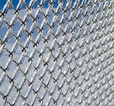 Ice coated chain link fence from an ice storm