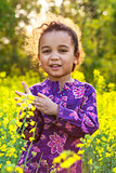 African American Girl Child in Field of Yellow Flowers