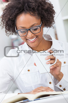 African American Woman Drinking Coffee Reading Book