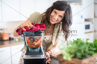 Multi ethnic girl preparing raw food