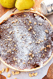 Caramel apple tart with nuts and sugar powder