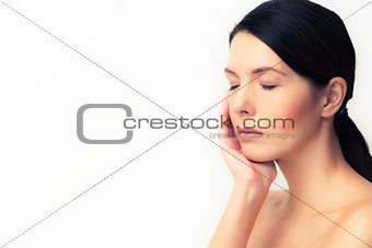 Tired woman relaxing with closed eyes
