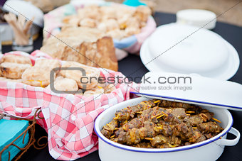 Fresh roasted bread and mutton kebabs in dishes