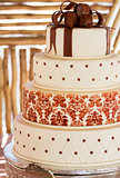 Layered white wedding cake with chocolate detail