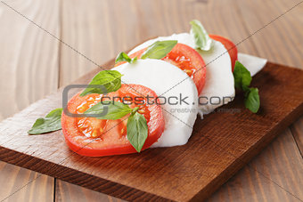 caprese salad made on cutting board