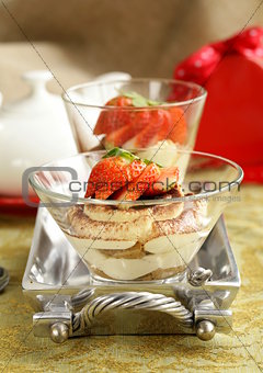 Italian dessert tiramisu decorated with strawberries