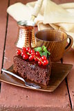 super chocolate cake (brownie) decorated with red currant and mint