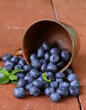 fresh organic ripe blueberries in a wooden bowl