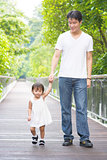  Father and daughter holding hands walking