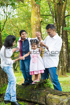 Happy Indian family outdoor fun