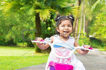 Cute Indian girl biking 