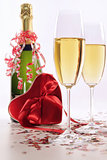 Glasses of champagne for Valentines day with heart and ribbons