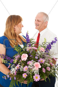 Husband Gives Flowers to His Wife