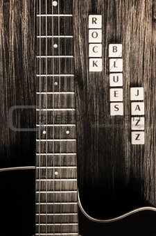 Detail of guitar and signs rock blues jazz in vintage style