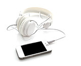 White headphones with mobile smartphone
