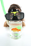 Woman watching a fish with goggles with holiday desire of diving