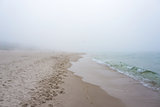 Foggy weather by the sea. Baltic beach.