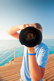 beach photographer with a large camera closeup