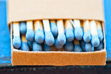 matchbox with blue heads closeup 