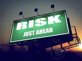 Risk Just Ahead on Green Billboard.