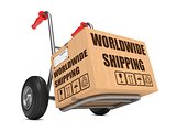 Worldwide Shipping - Cardboard Box on Hand Truck.