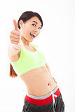 young woman doing her workout with thumb up 