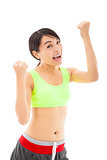young woman doing her workout with success gesture