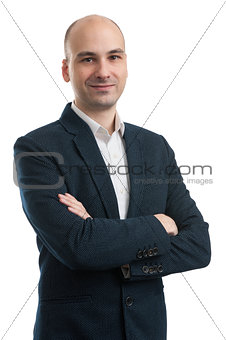 Handsome business man standing with arms folded