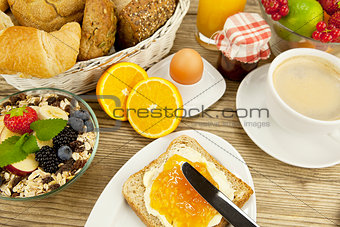 tasty breackfast with toast and marmelade on table
