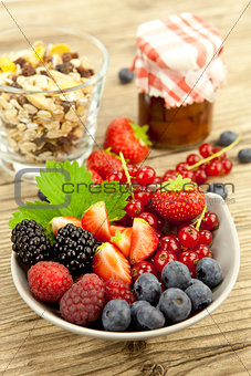 fresh tasty berry collection on table in summer