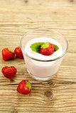 fresh tasty strawberry yoghurt shake dessert on table