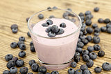 fresh delicious blueberry yoghurt shake dessert on table