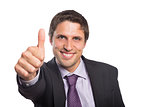 Close-up of a businessman gesturing thumbs up