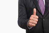 Mid section of a businessman gesturing thumbs up