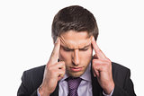 Tensed businessman suffering from headache