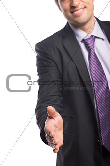 Smiling businessman offering a handshake