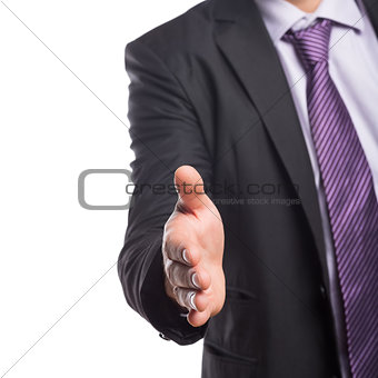 Mid section of businessman offering a handshake