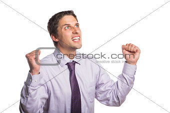 Elegant businessman cheering with clenched hands against white background
