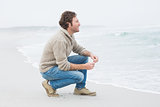 Side view of a casual young man relaxing at beach