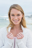 Close-up portrait of a smiling casual woman at beach