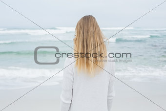 Rear view of a casual blond at beach