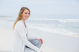 Smiling casual young woman relaxing at beach